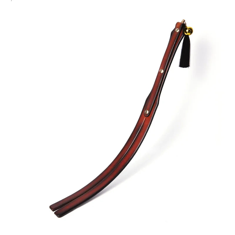 two-strap vintage leather spanking paddle full view showing aged finish