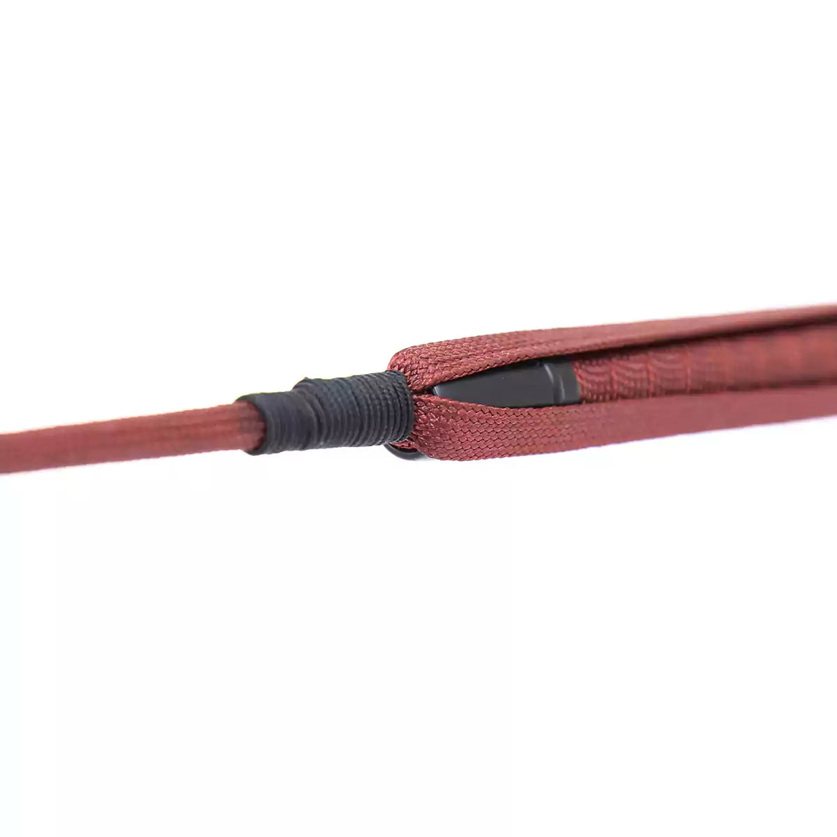 Second detail view of red long riding crop shaft construction