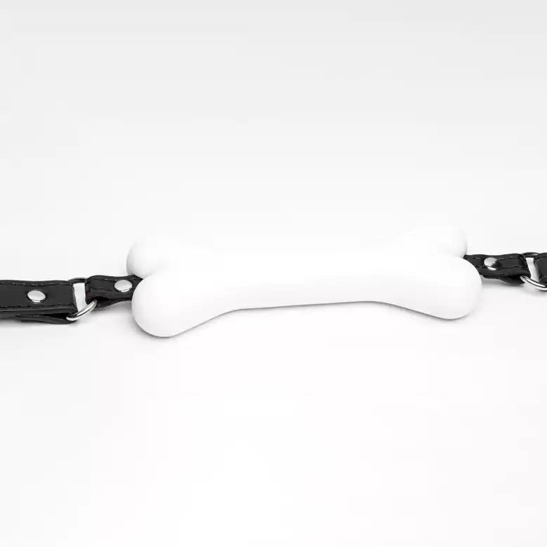 close-up detail of bone-shaped silicone mouthpiece showing smooth surface