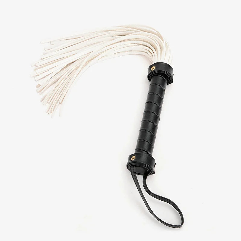 angled display of soft suede BDSM flogger showing fringe texture