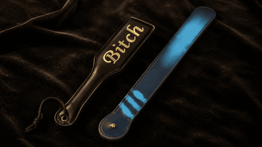 expensive quality leather paddle beside budget paddle on dark surface showing price comparison test
