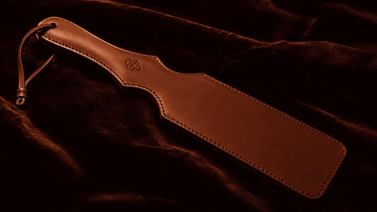 quality entry level leather paddle on dark surface for beginning couples