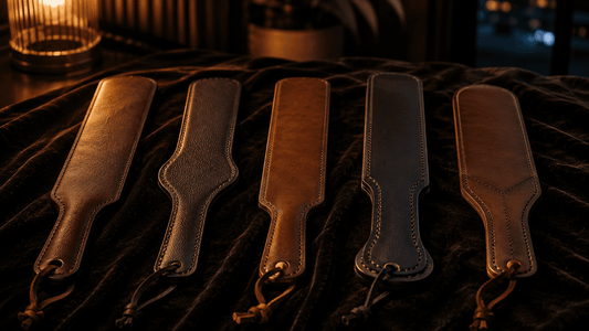 ive leather paddles arranged on dark surface tested for quiet apartment impact play