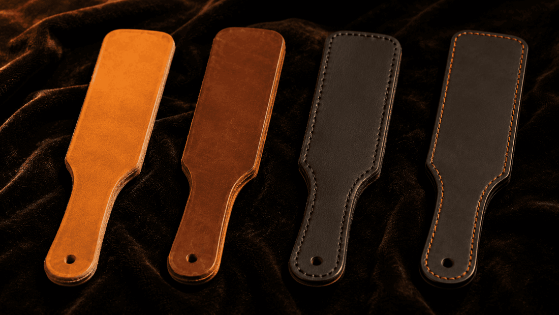 four leather paddles of different thickness and construction on dark surface for comparison 