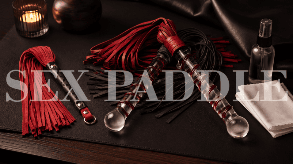 personal and shared leather floggers with cleaning supplies in moody studio lighting