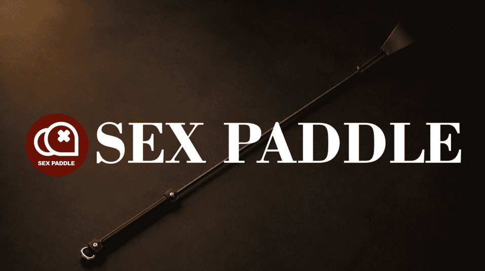 riding crop in a moody close-up scene showing tip material