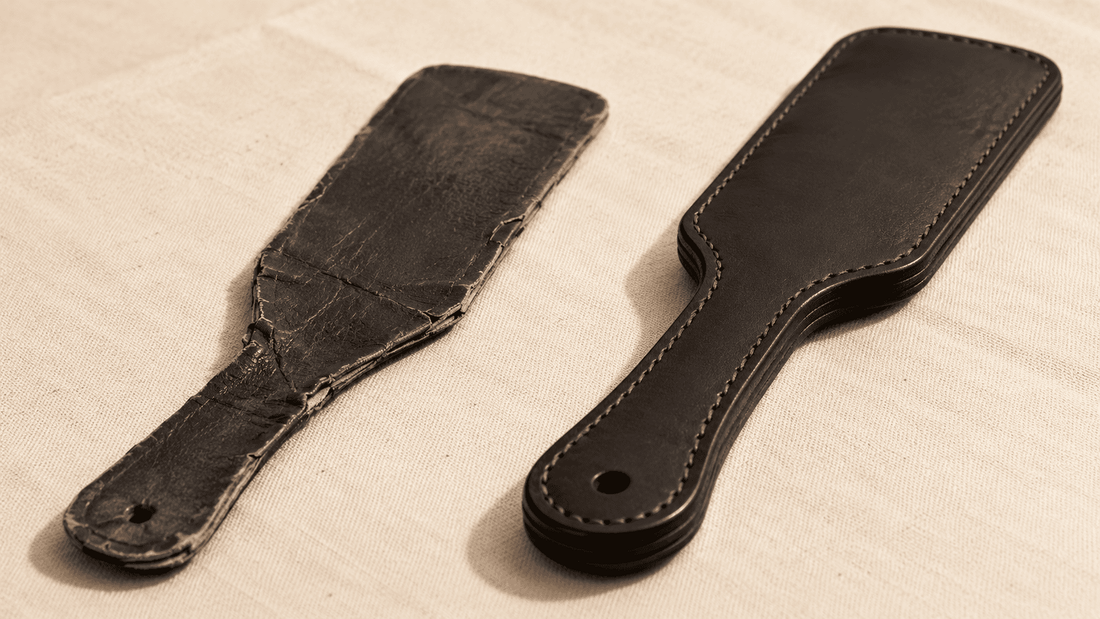 worn cheap paddle beside quality leather paddle showing contrast after real use 