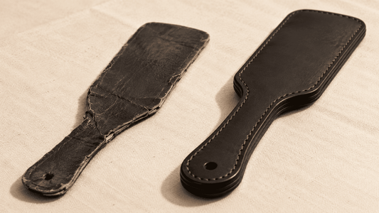 worn cheap paddle beside quality leather paddle showing contrast after real use 