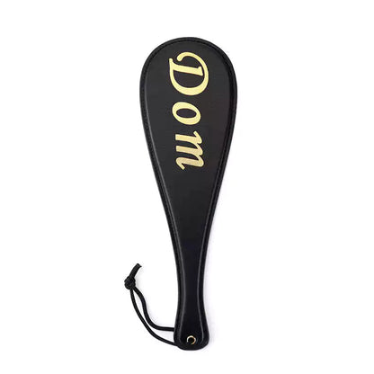 Pala para nalgadas "Black Gold-Letter" — Cuero de PU, Diseño con letras doradas