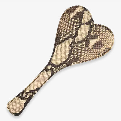 Beige snake-pattern heart paddle on a white background