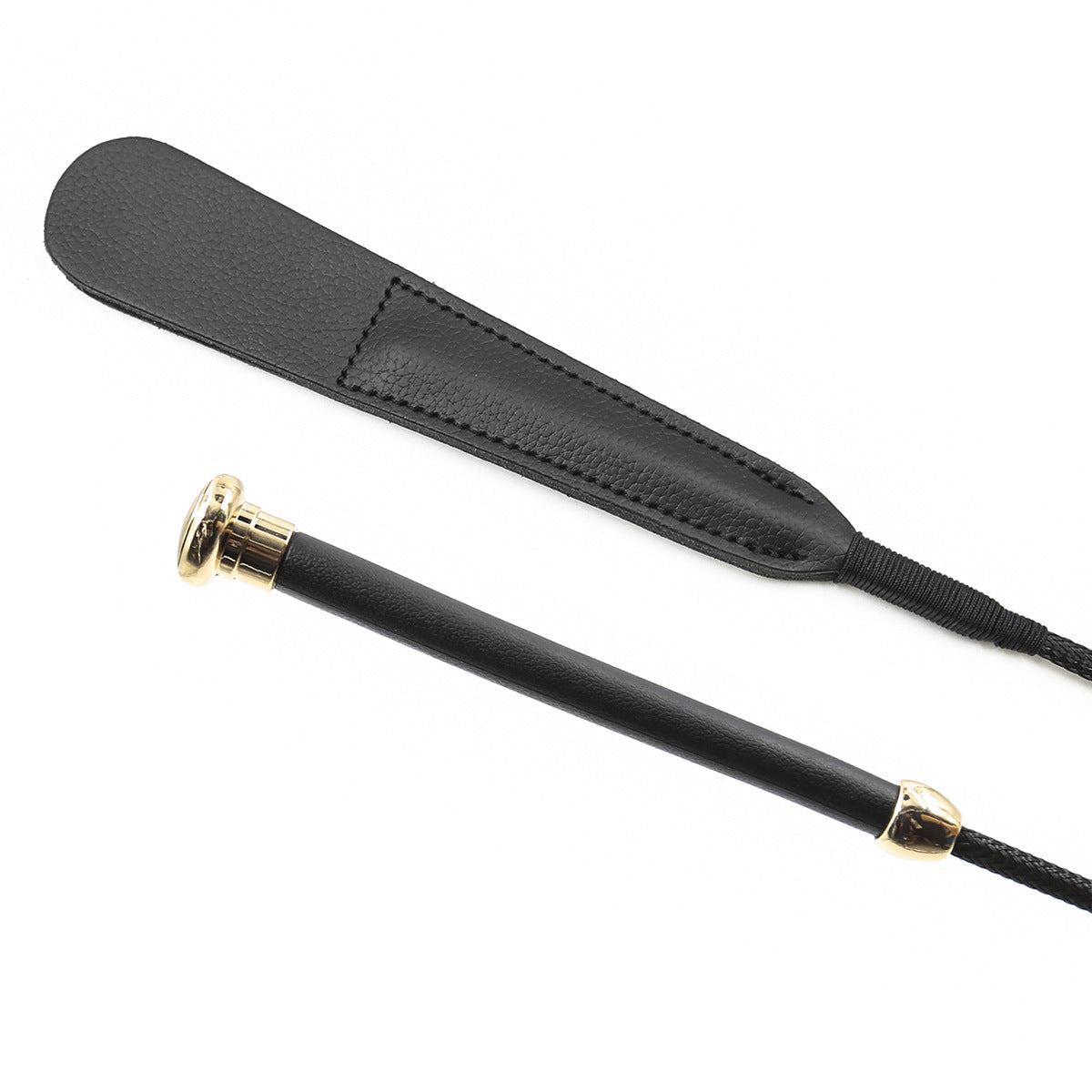 Black cowhide riding crop close-up detail showing leather texture