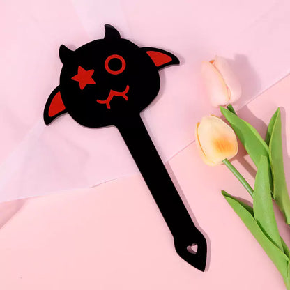 Black Devil Acrylic Spanking Paddle in themed roleplay scene