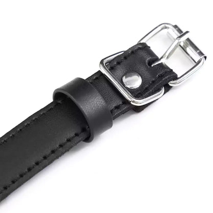 Black reversible phallic ball gag shown in a detailed product close-up