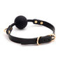 Minimalist gold-tone ball gag angled full view