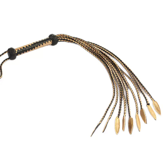 full-grain black and gold leather flogger showing balanced multi-strand structure