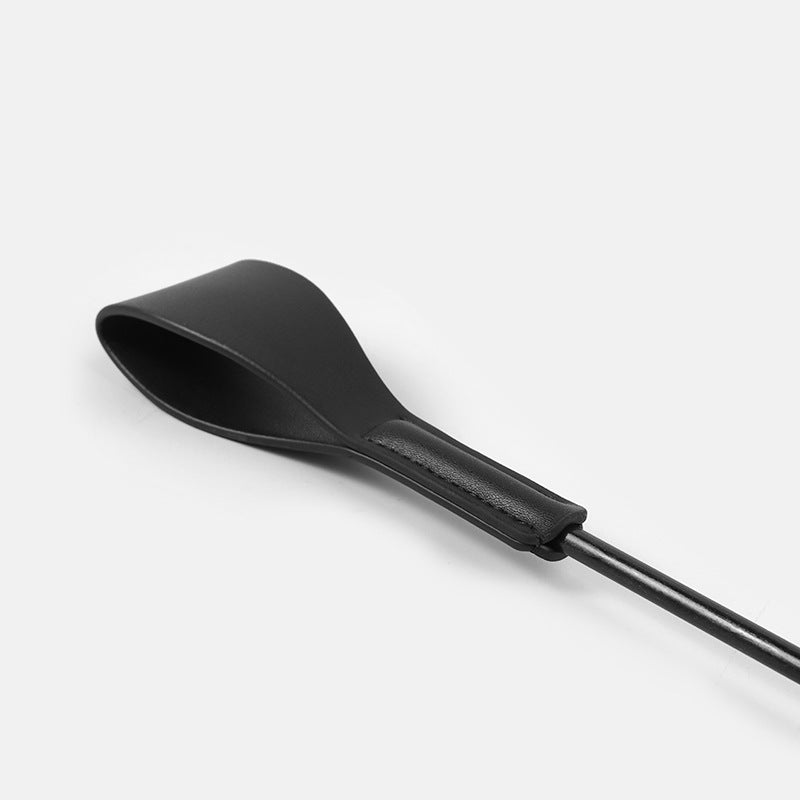 close-up of thick leather crop head with gold detail