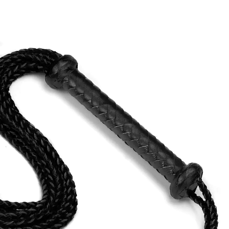 close-up of braided leather handle grip on nine-tail flogger