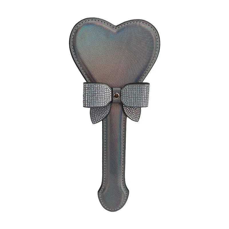 Black iridescent heart-shaped spanking paddle full view with decorative bow detail