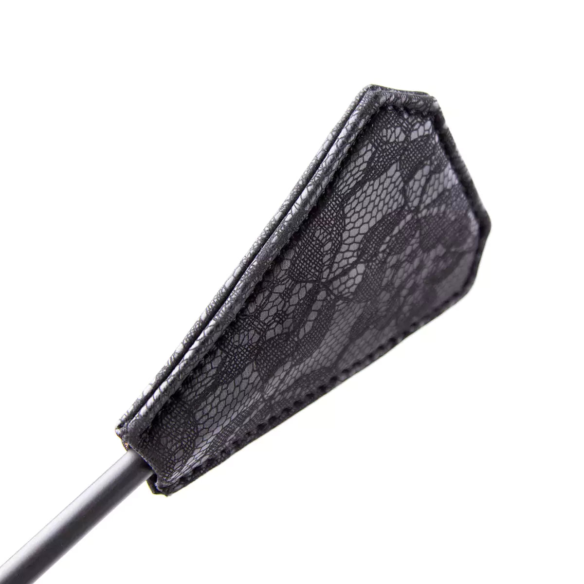 Close-up of lace-textured striking surface on black feather tickler crop
