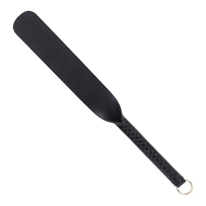 Black silicone BDSM paddle on white background
