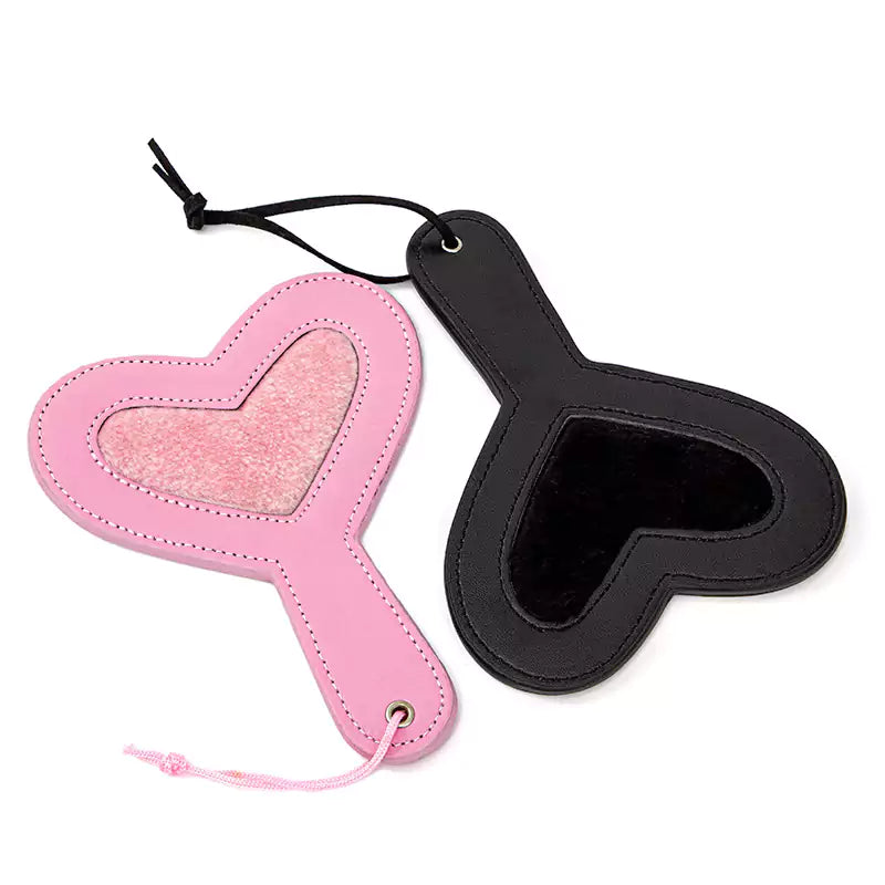 Black and pink plush heart spanking paddles full view