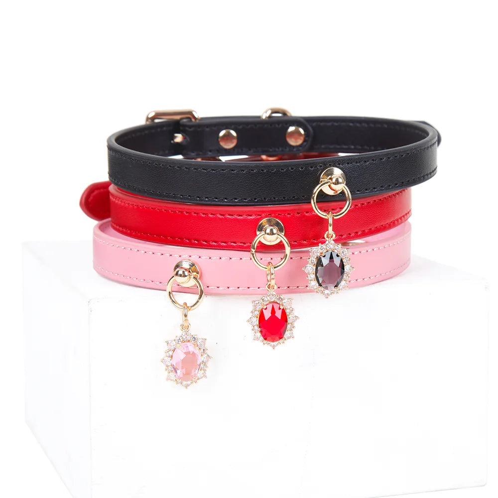 Black pink and rose leather gem pendant collars grouped together