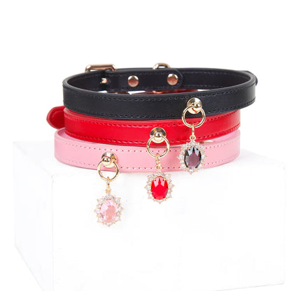 Black pink and rose leather gem pendant collars grouped together