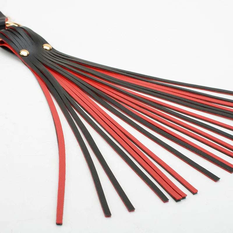 close-up of black and red faux leather strap surface