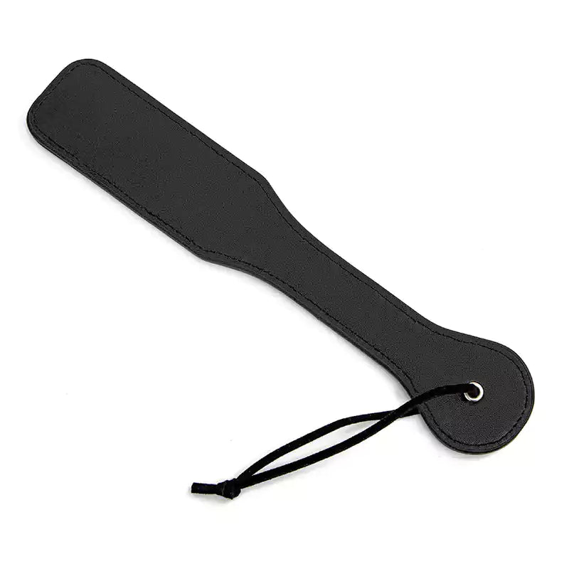 Back view of black smiley leather spanking paddle showing smooth surface