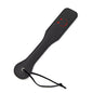 Black smiley leather spanking paddle full view under studio lighting