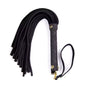 black suede BDSM flogger illustrating compact structure and layered sensation play