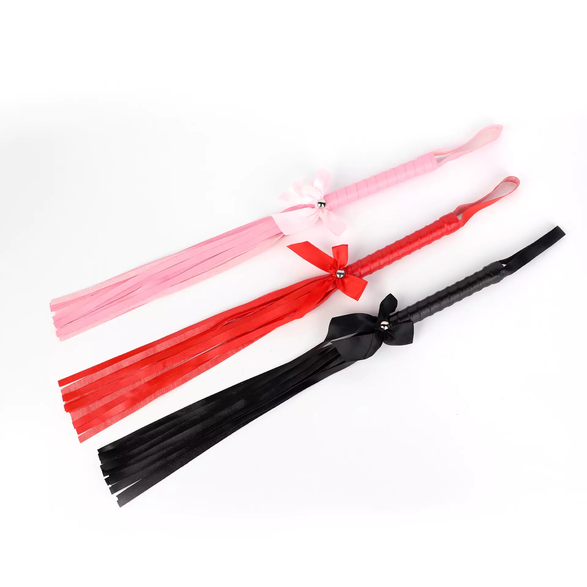 Black, red and pink bow-tie fringe floggers displayed together