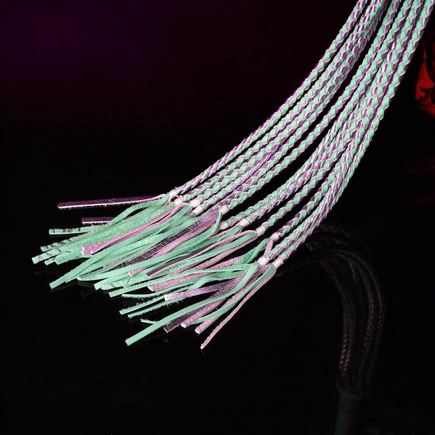 close-up of braided leather strands and soft tassel tips creating flowing impact