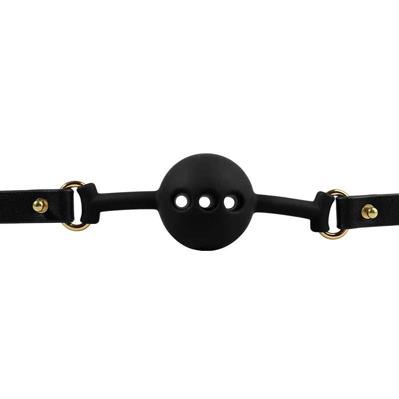 Close-up detail of the black breathable silicone ball gag with air holes