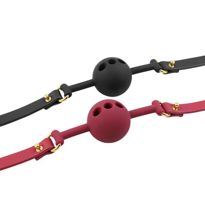 Black and red breathable silicone ball gags with air holes shown together