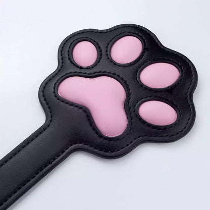 Close-up of 3D silicone paw pads on spanking paddle