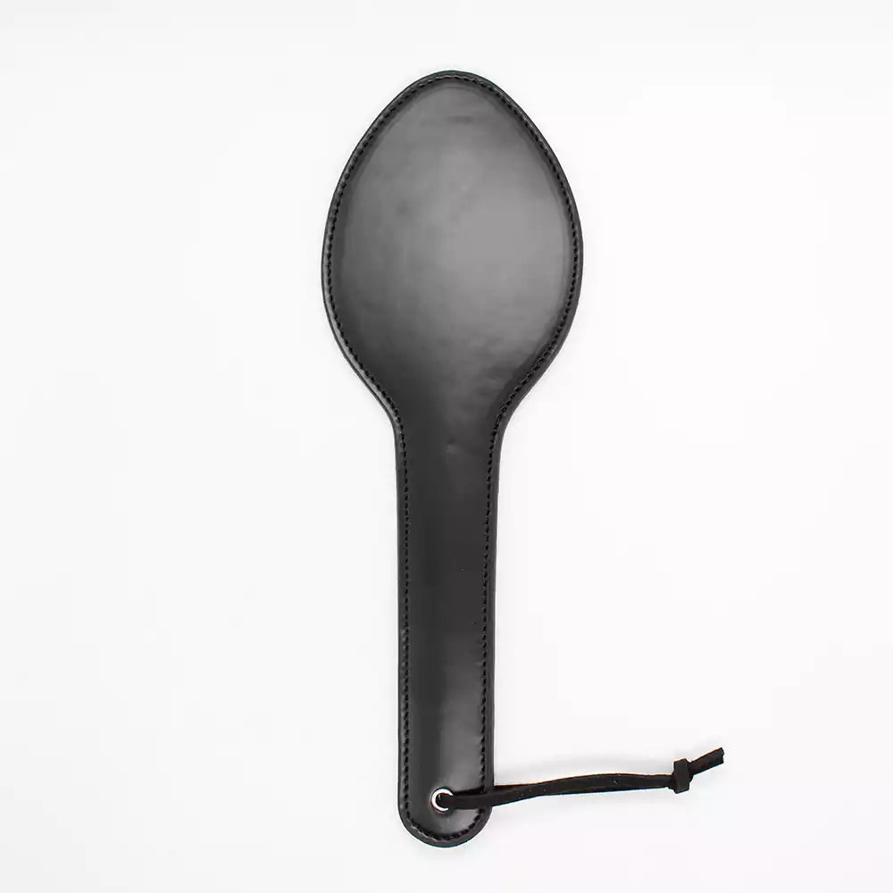 Front view of classic black leather spanking paddle