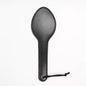Front view of classic black leather spanking paddle