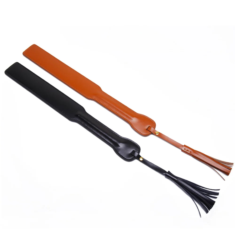 Black and brown leather paddles with tassel displayed together