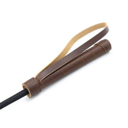 Second close-up of woven handle and wrist loop on classic riding crop