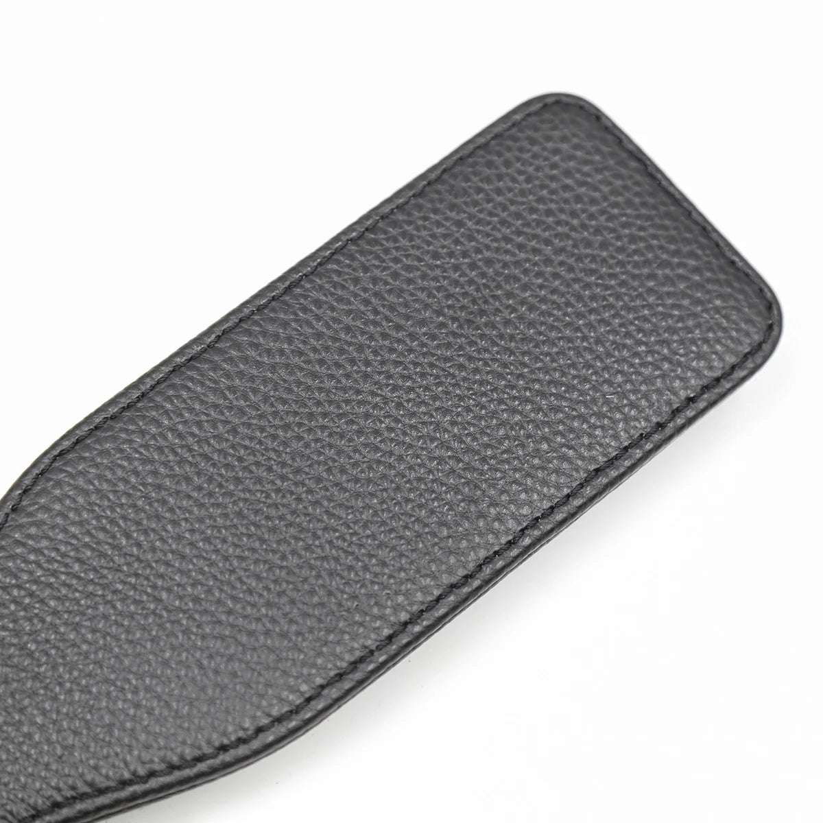 Close-up of faux leather strike surface on slim paddle