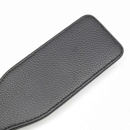 Close-up of faux leather strike surface on slim paddle