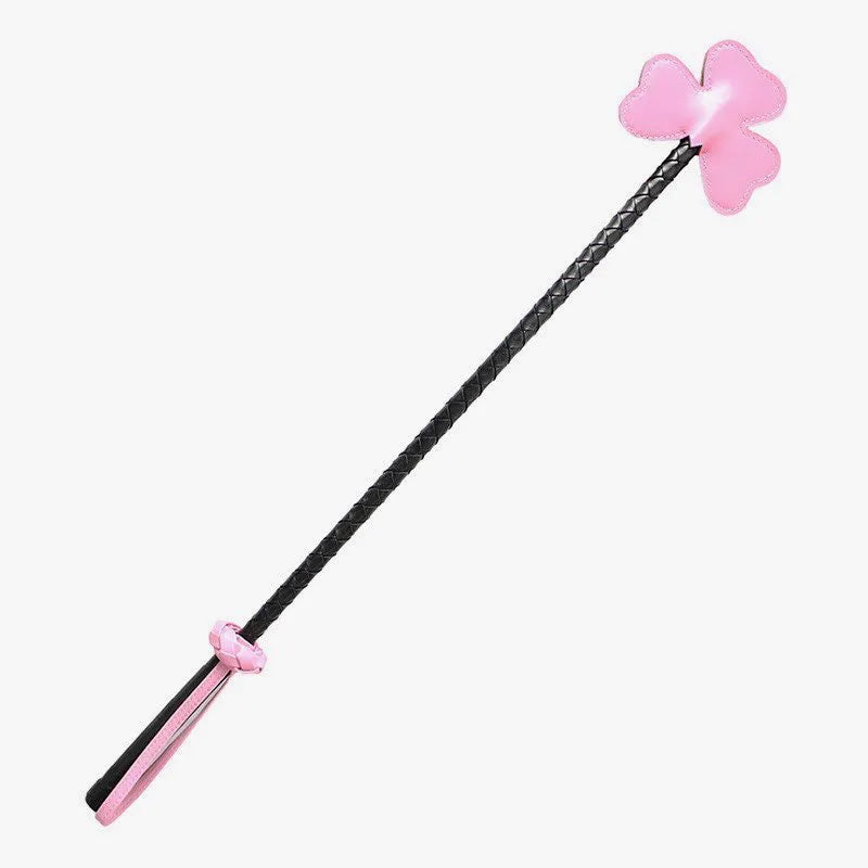 Pink clover leather riding crop with braided shaft full view