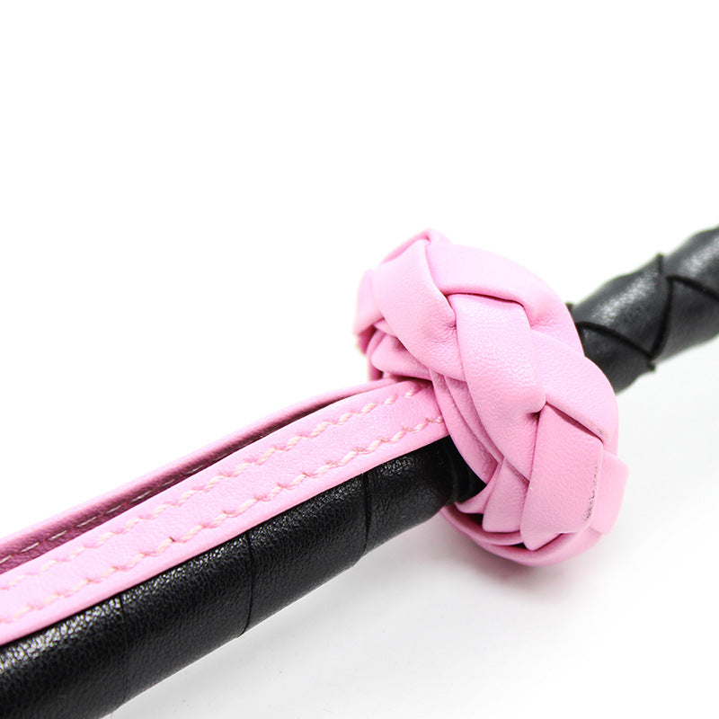 Close-up of shaft connection detail on clover leather riding crop