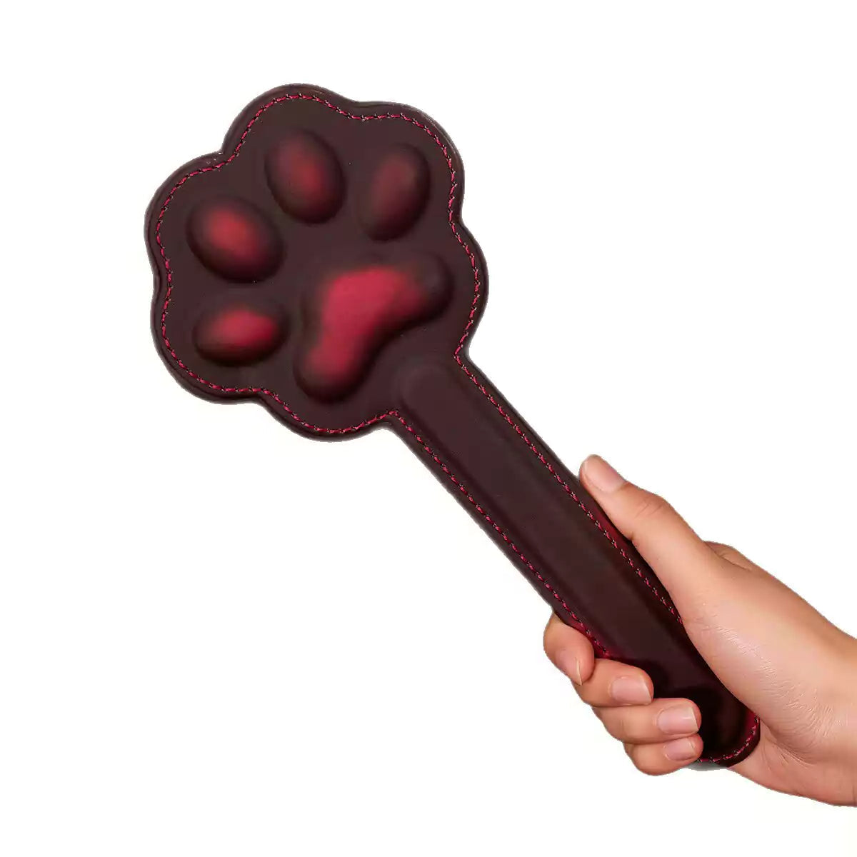 Black heat-reactive cat paw spanking board on white background