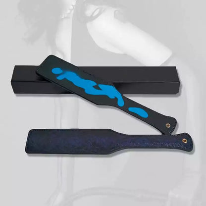 Heat-reactive snake pattern spanking board in atmospheric setting