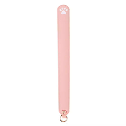 Pink silicone cat paw paddle on white background