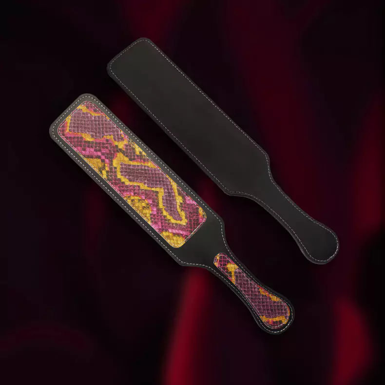 Front and back view of iridescent python leather paddle in scene setting