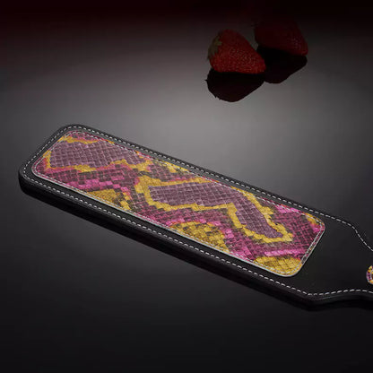 Close-up of embossed python texture on leather paddle