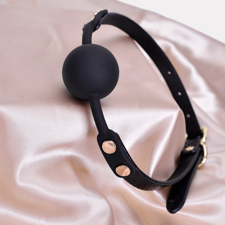 Angled perspective of croc texture silicone ball gag